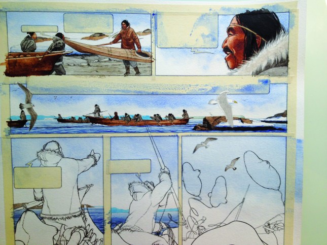 Figure 7: An example of the drawing process. Nuka has drawn the sketch on watercolour paper, after which he covers those areas with tape and colours in the rest.